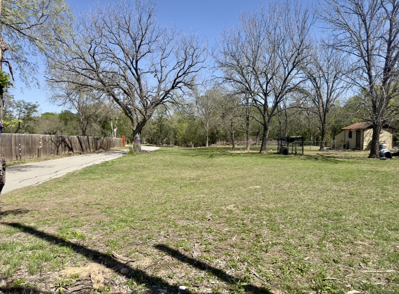 600 Sabine Street Lockhart, TX 78644 - Photo 2 of 19 a view of a field with trees in the background