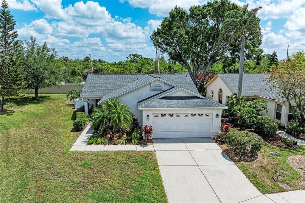4723 Raintree St Circle East Bradenton, FL 34203 - Photo 1 of 1 a view of a house with a yard