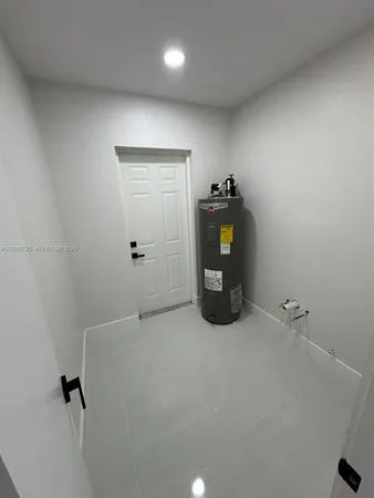 a view of a storage and utility room with closet