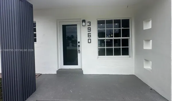 a view of empty room with windows