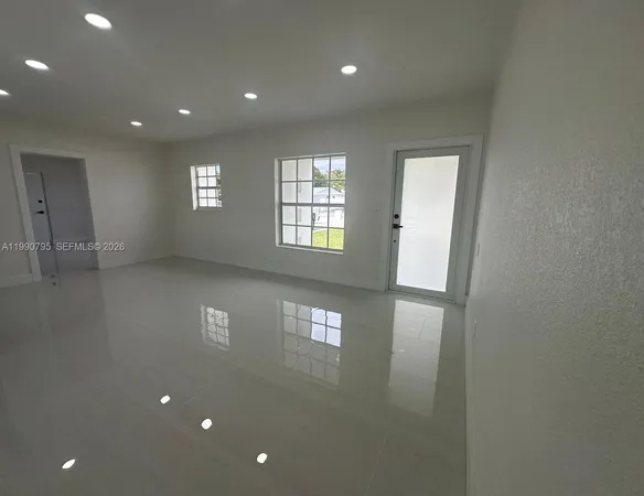 a view of an empty room with a window