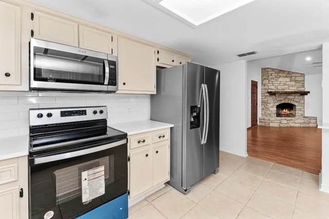 a living room with furniture and flat screen tv
