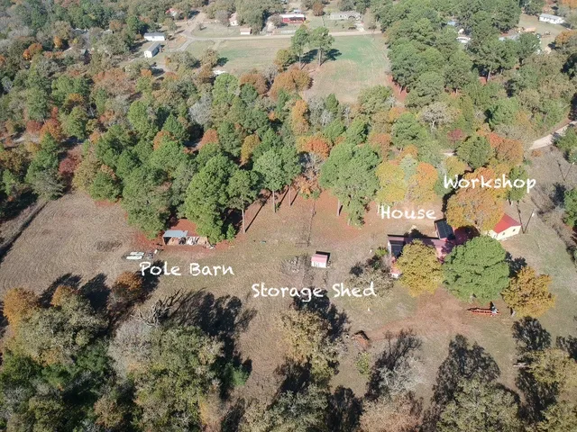 an aerial view of a house with a yard