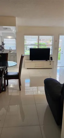 a view of a living room with a fireplace