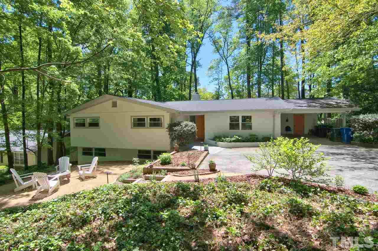 3105 Buckingham Road Durham, NC 27707 - Photo 2 of 25 a backyard of a house with table and chairs