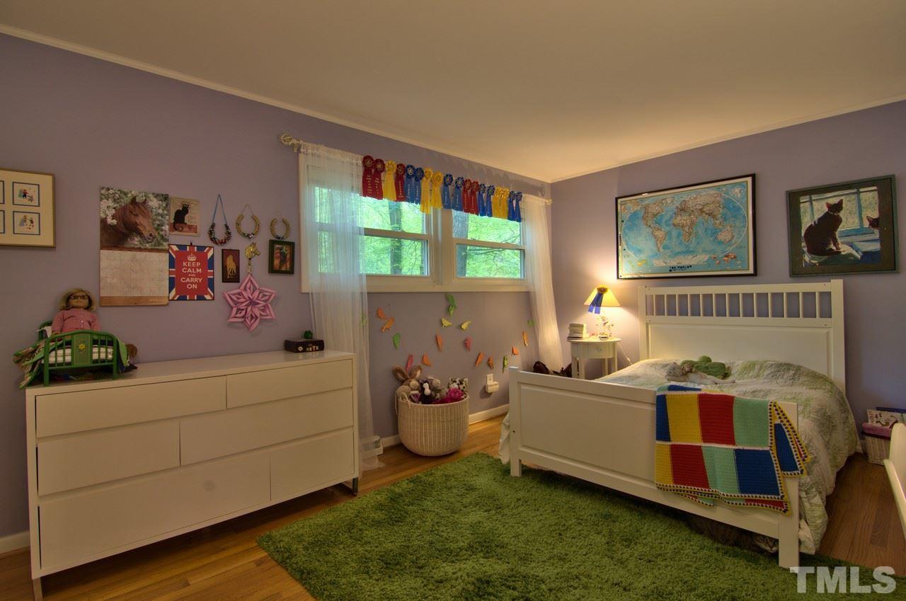 3105 Buckingham Road Durham, NC 27707 - Photo 17 of 25 a bedroom with furniture and a large window