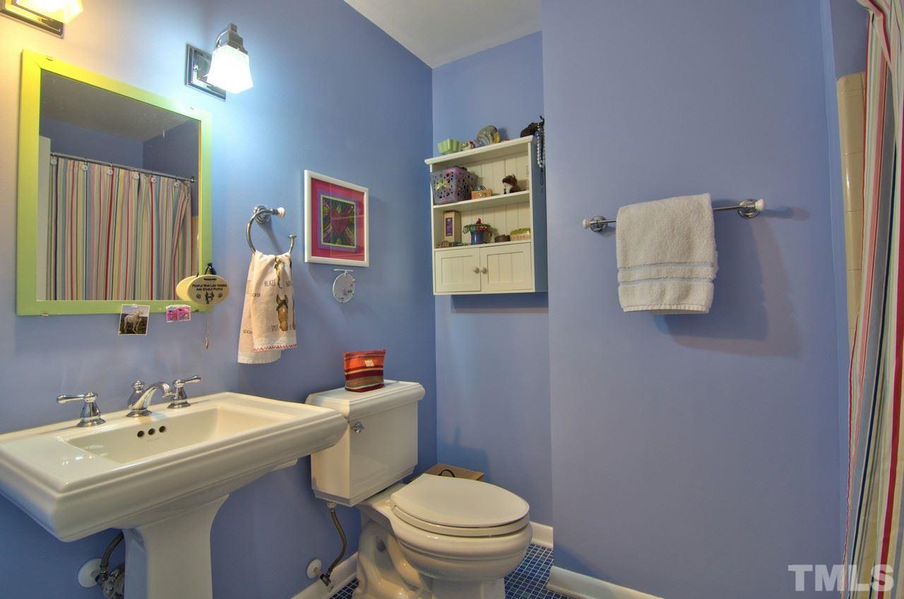 3105 Buckingham Road Durham, NC 27707 - Photo 18 of 25 a bathroom with a toilet sink and mirror