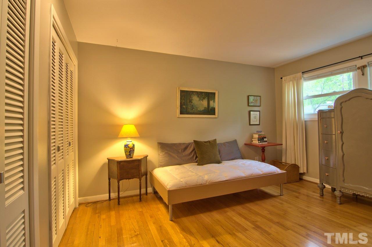 3105 Buckingham Road Durham, NC 27707 - Photo 21 of 25 a spacious bedroom with a bed and wooden floor