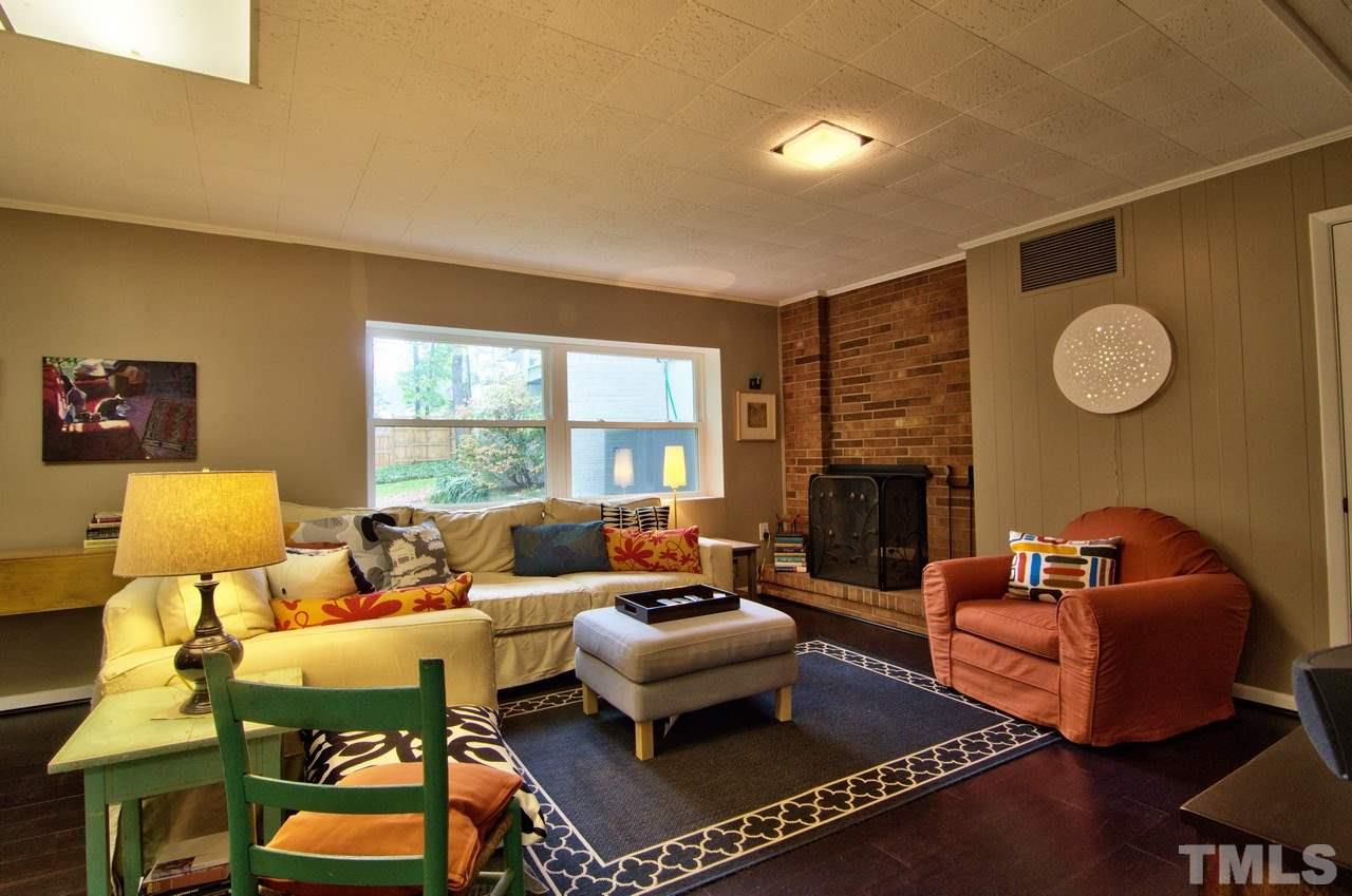3105 Buckingham Road Durham, NC 27707 - Photo 22 of 25 a living room with furniture fireplace and window