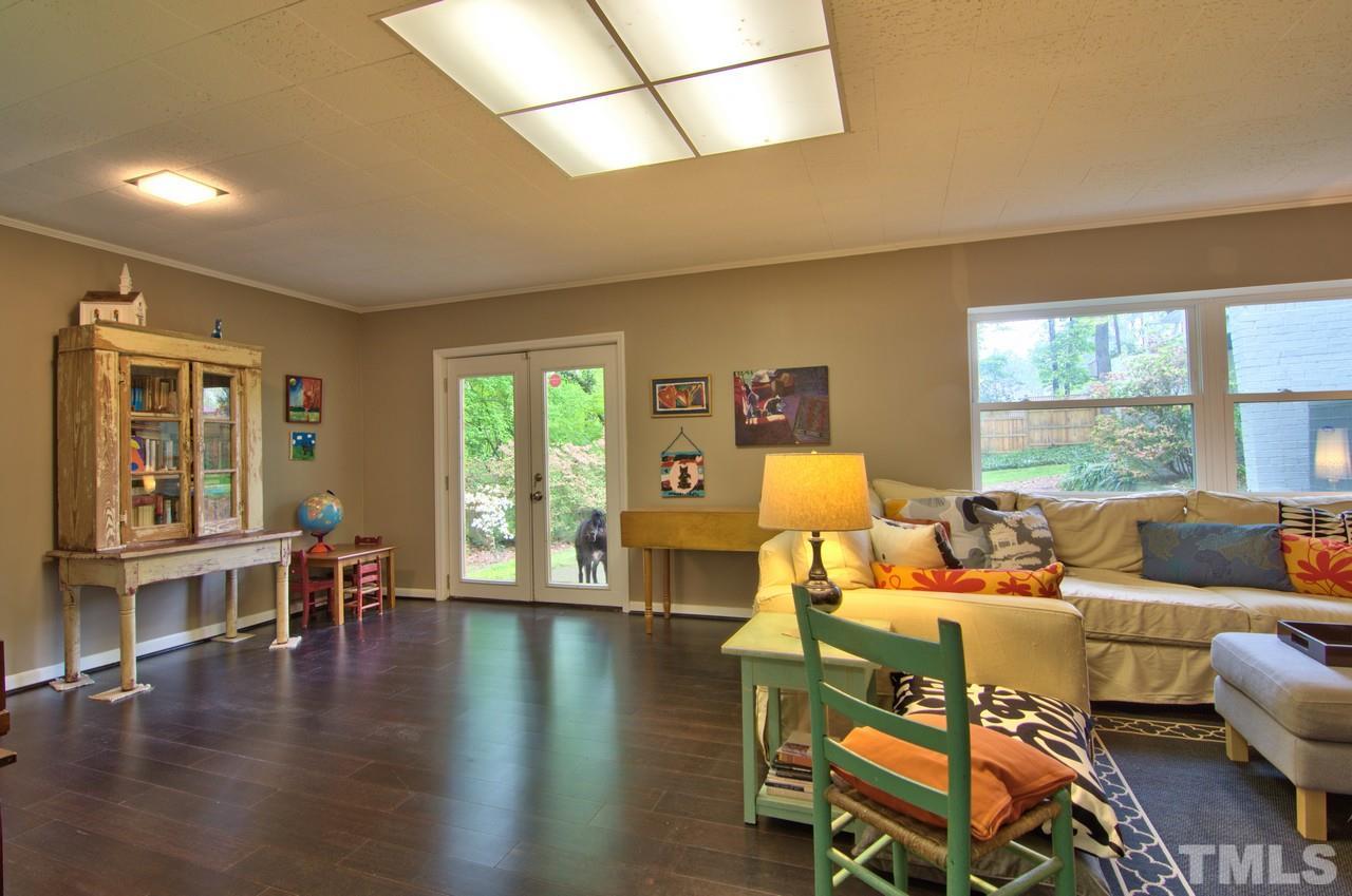 3105 Buckingham Road Durham, NC 27707 - Photo 23 of 25 a living room with furniture and wooden floor