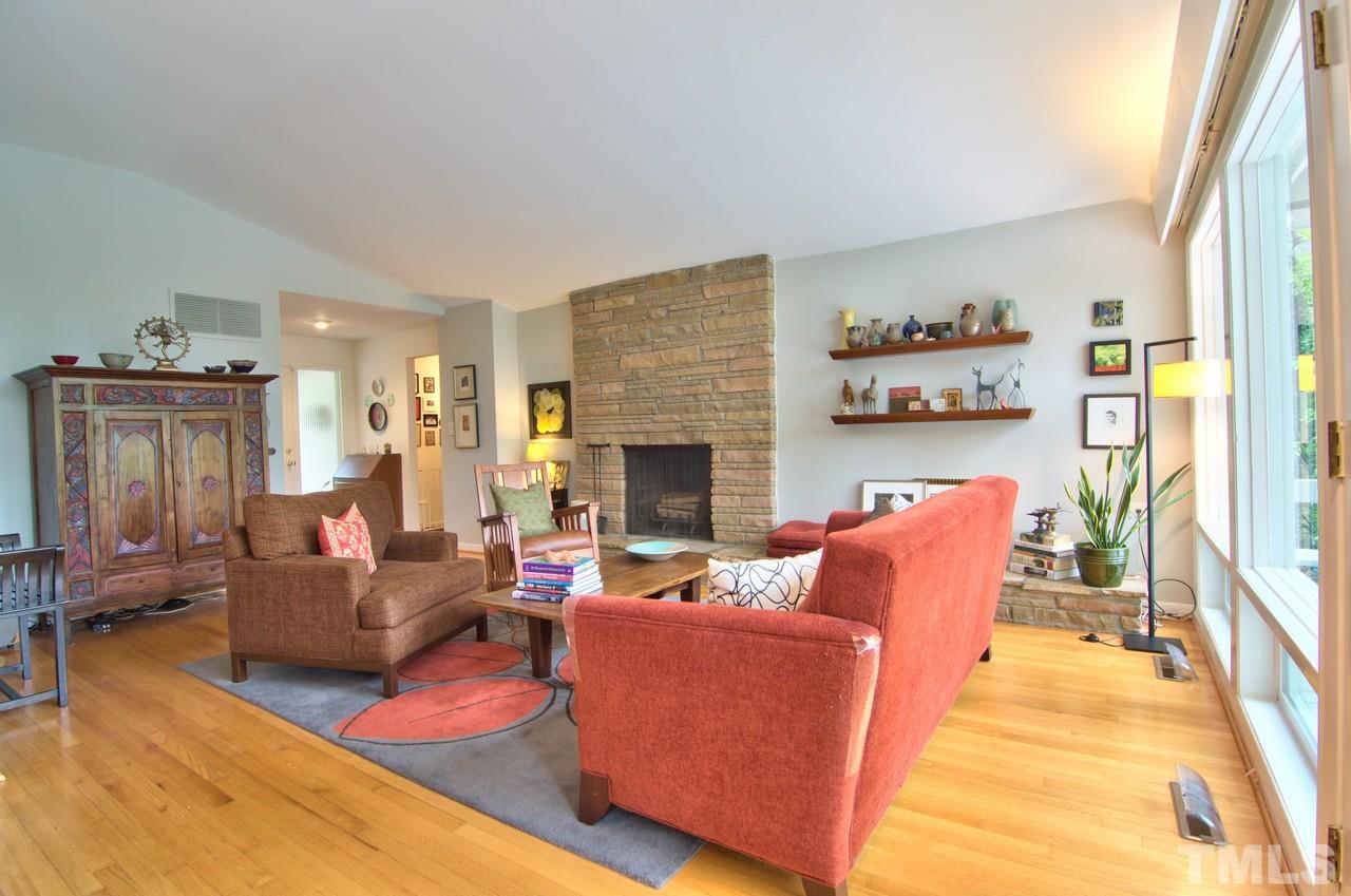 3105 Buckingham Road Durham, NC 27707 - Photo 4 of 25 a living room with furniture and a fireplace