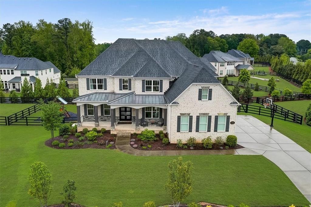 1740 Bates Road Alpharetta, GA 30009 - Photo 1 of 1 a front view of a house with a garden