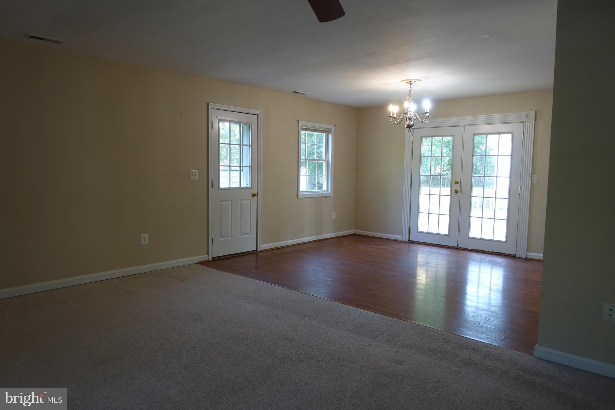 702 Old Love Point Road Stevensville, MD 21666 - Photo 7 of 41 Dining area features side entrance & french doors