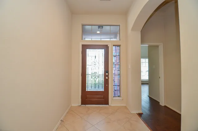 a view of an entryway with wooden floor