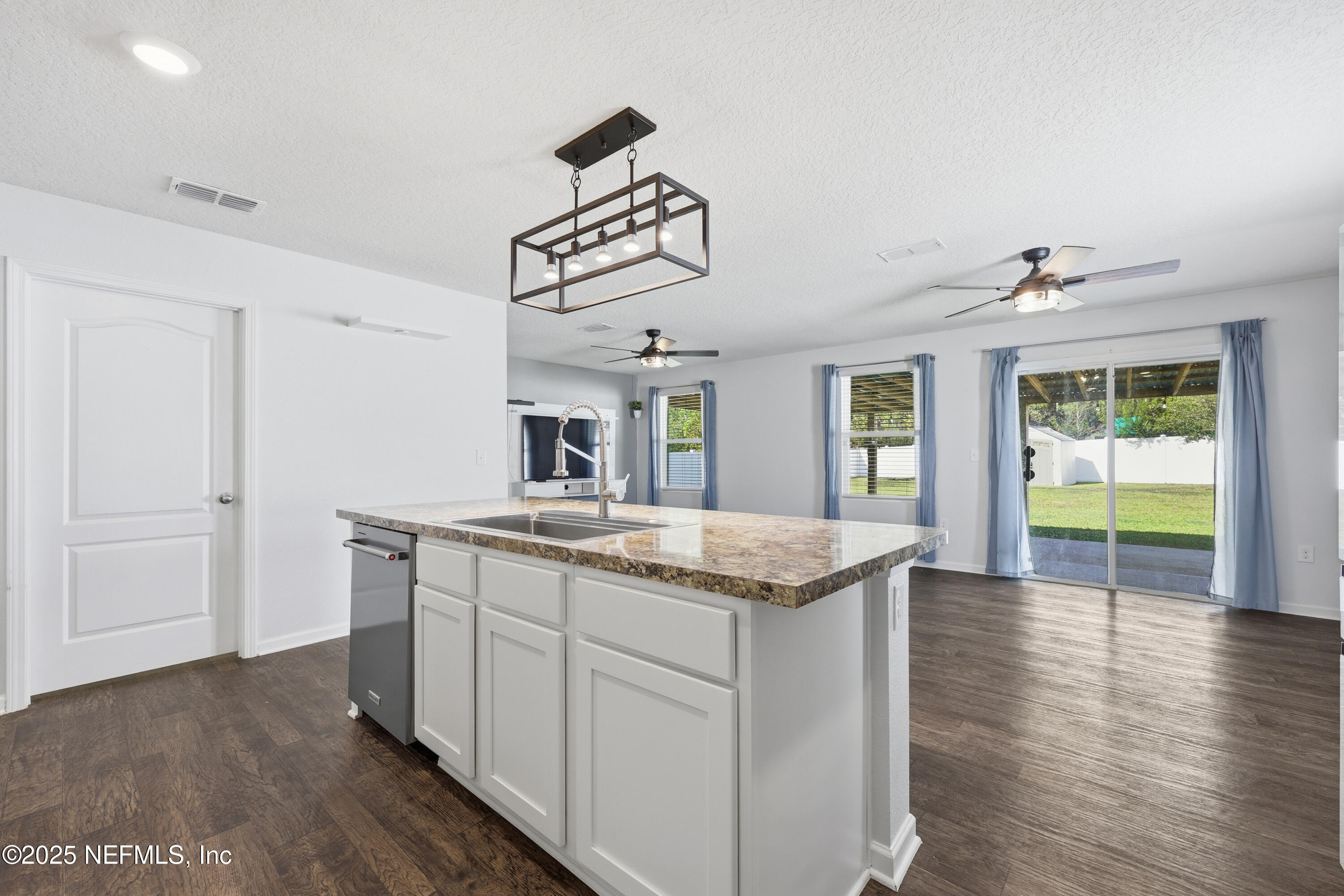 4298 Warm Springs Way Middleburg, FL 32068 - Photo 2 of 36 a kitchen with a sink and cabinets