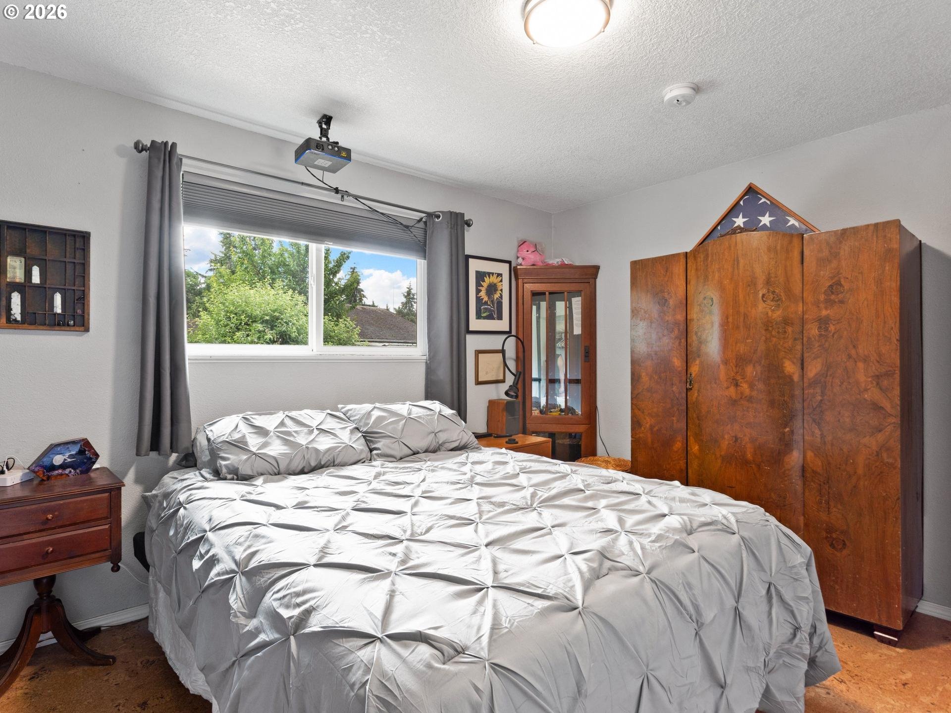 1719 Southwest 1st Street Battle Ground, WA 98604 - Photo 21 of 37 a bedroom with a large bed and a window