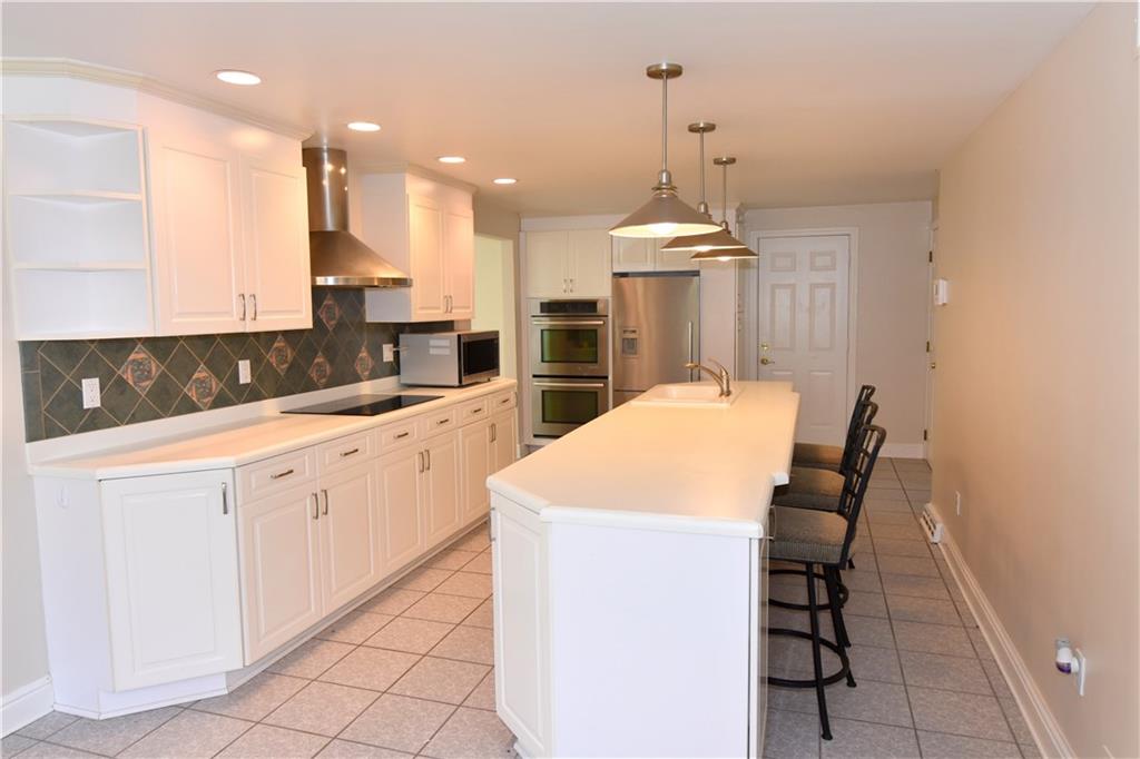428 Burnside Road Canonsburg, PA 15317 - Photo 7 of 25 FRESHLY Painted!! Huge Kitchen 28x12 Tile floor plenty of cabinets and counter space.