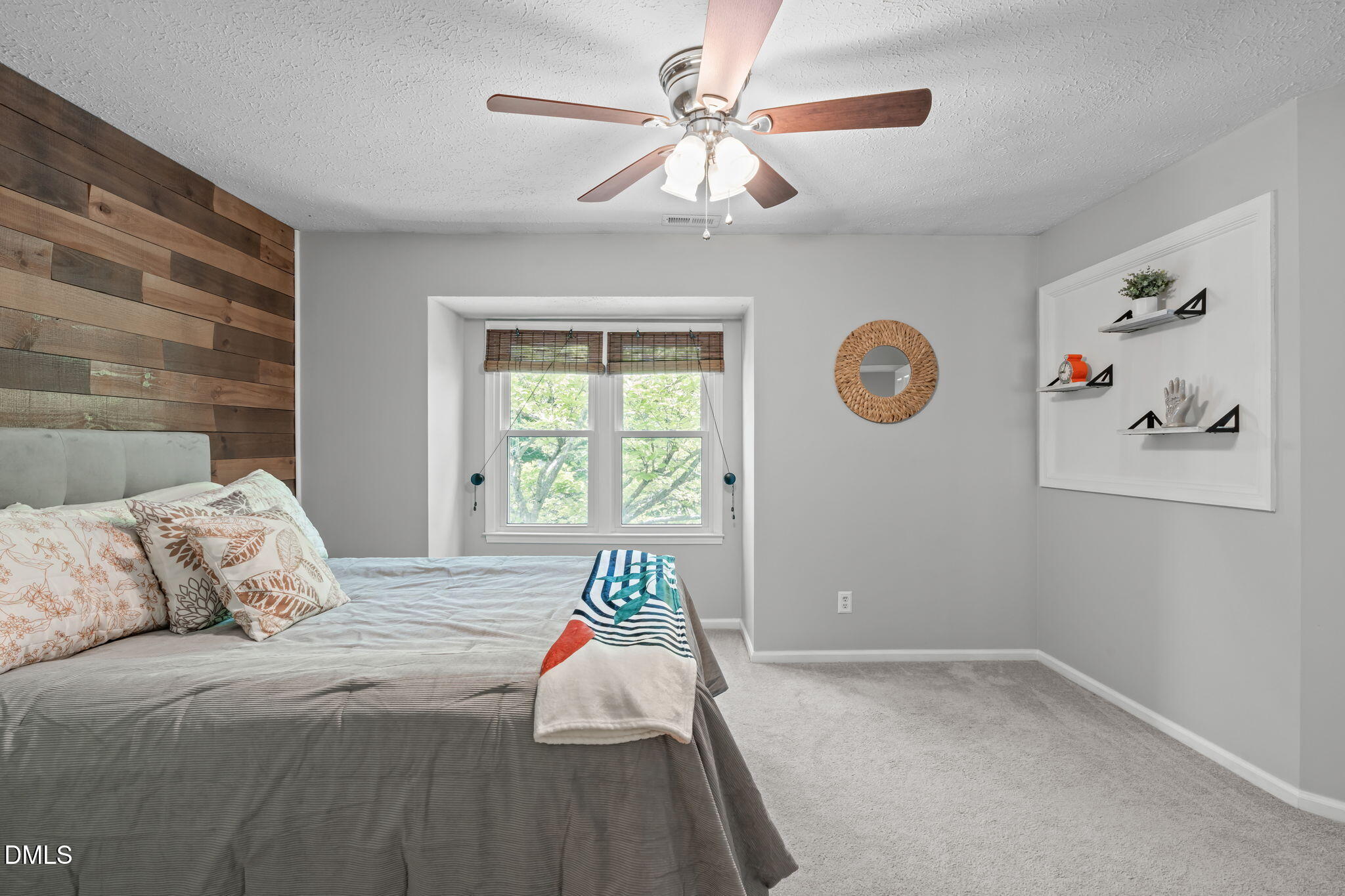 203 Oak Hollow Court Raleigh, NC 27613 - Photo 22 of 37 a bedroom with a bed and a window