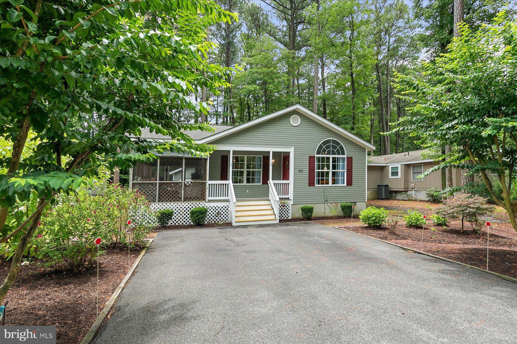 120 Pinehurst Road Berlin, MD 21811 - Photo 1 of 37 a front view of a house with a garden