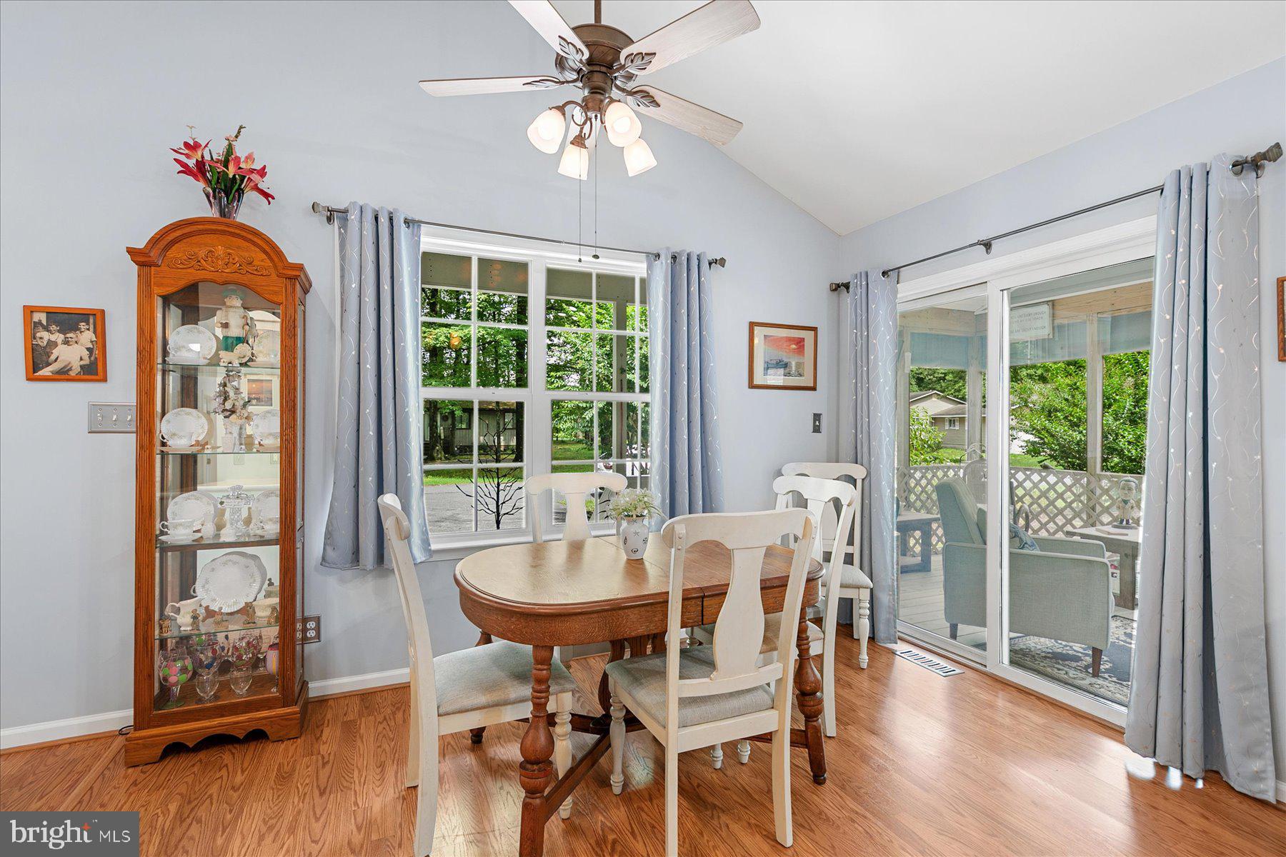 120 Pinehurst Road Berlin, MD 21811 - Photo 13 of 37 a dining room with furniture a chandelier and wooden floor