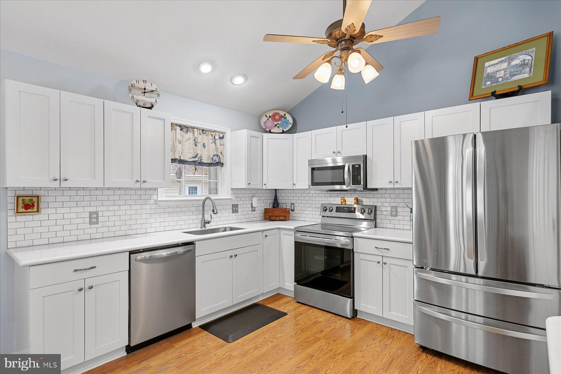 120 Pinehurst Road Berlin, MD 21811 - Photo 14 of 37 a kitchen with a sink stainless steel appliances and white cabinets