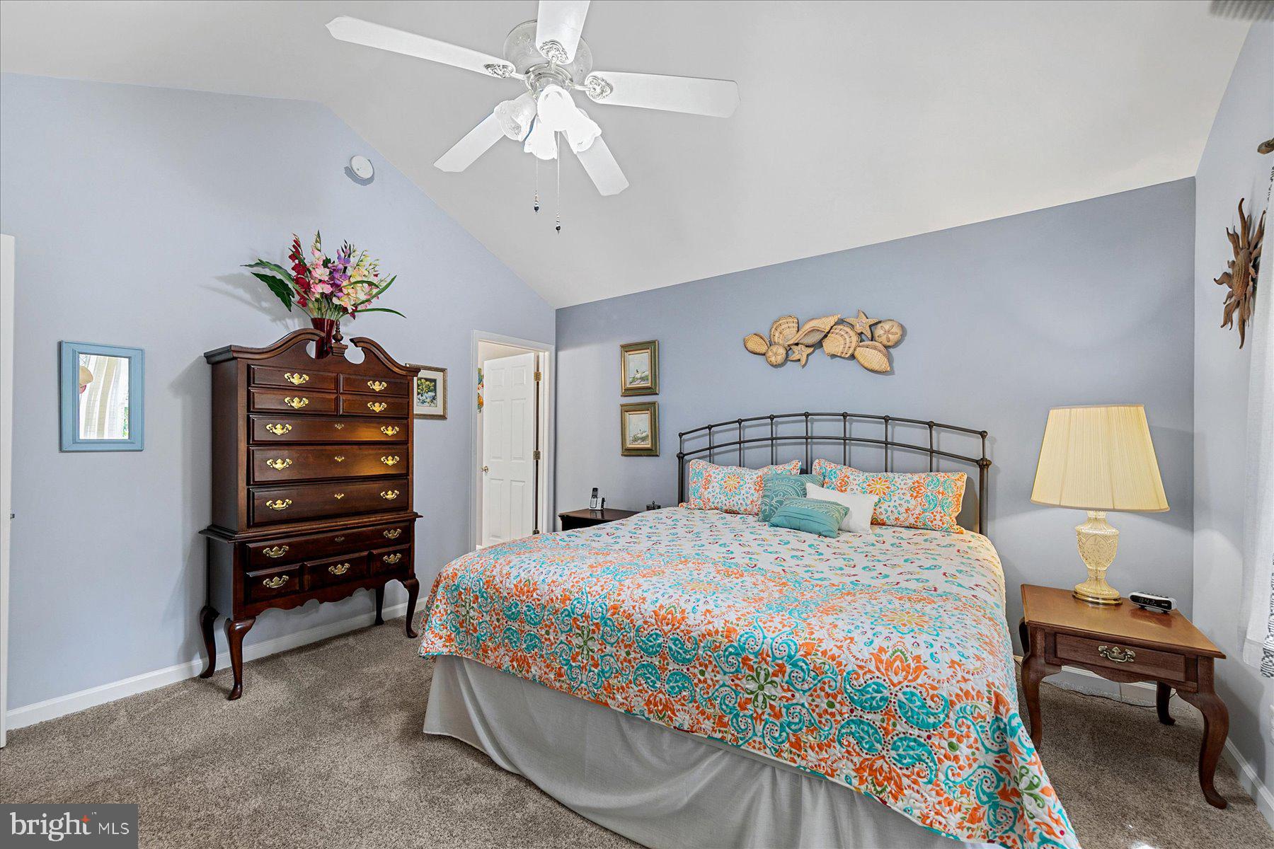 120 Pinehurst Road Berlin, MD 21811 - Photo 19 of 37 a bedroom with a bed and a chandelier