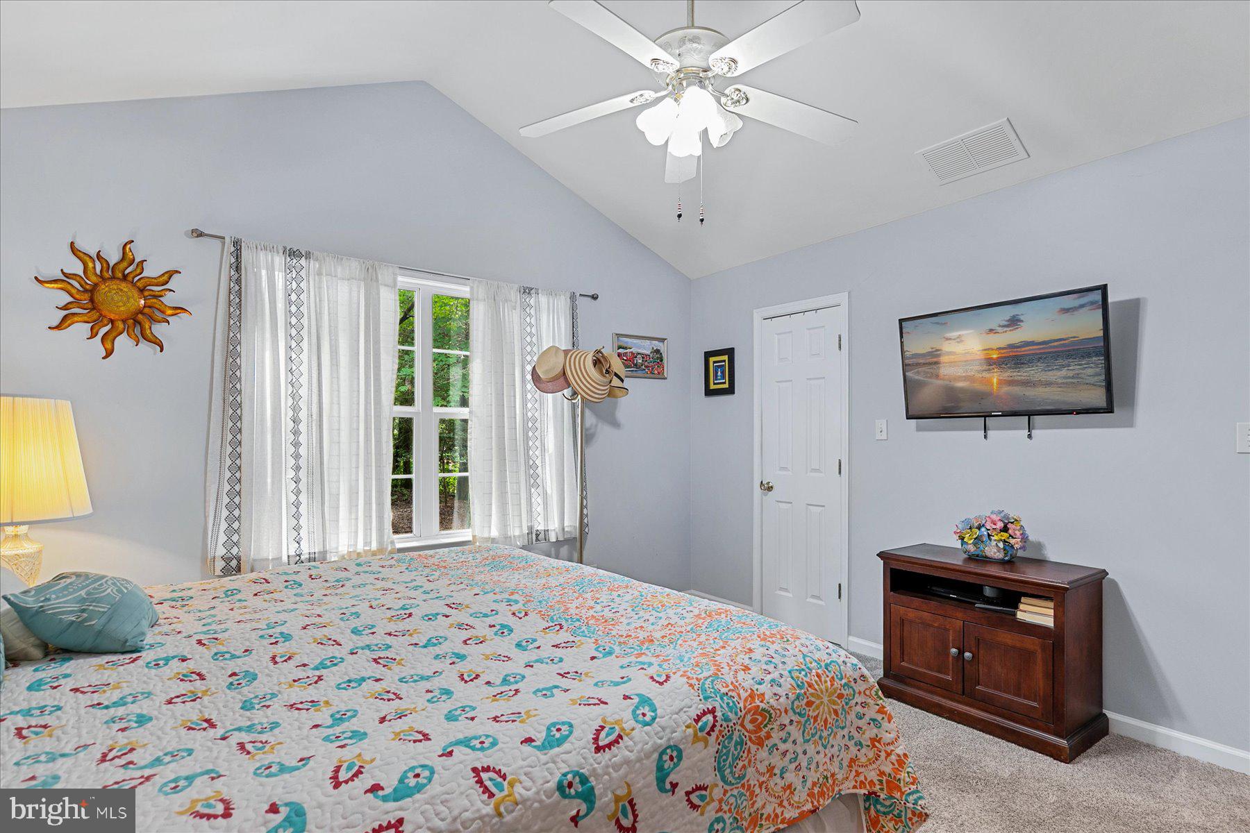 120 Pinehurst Road Berlin, MD 21811 - Photo 20 of 37 a bedroom with a bed and a flat screen tv