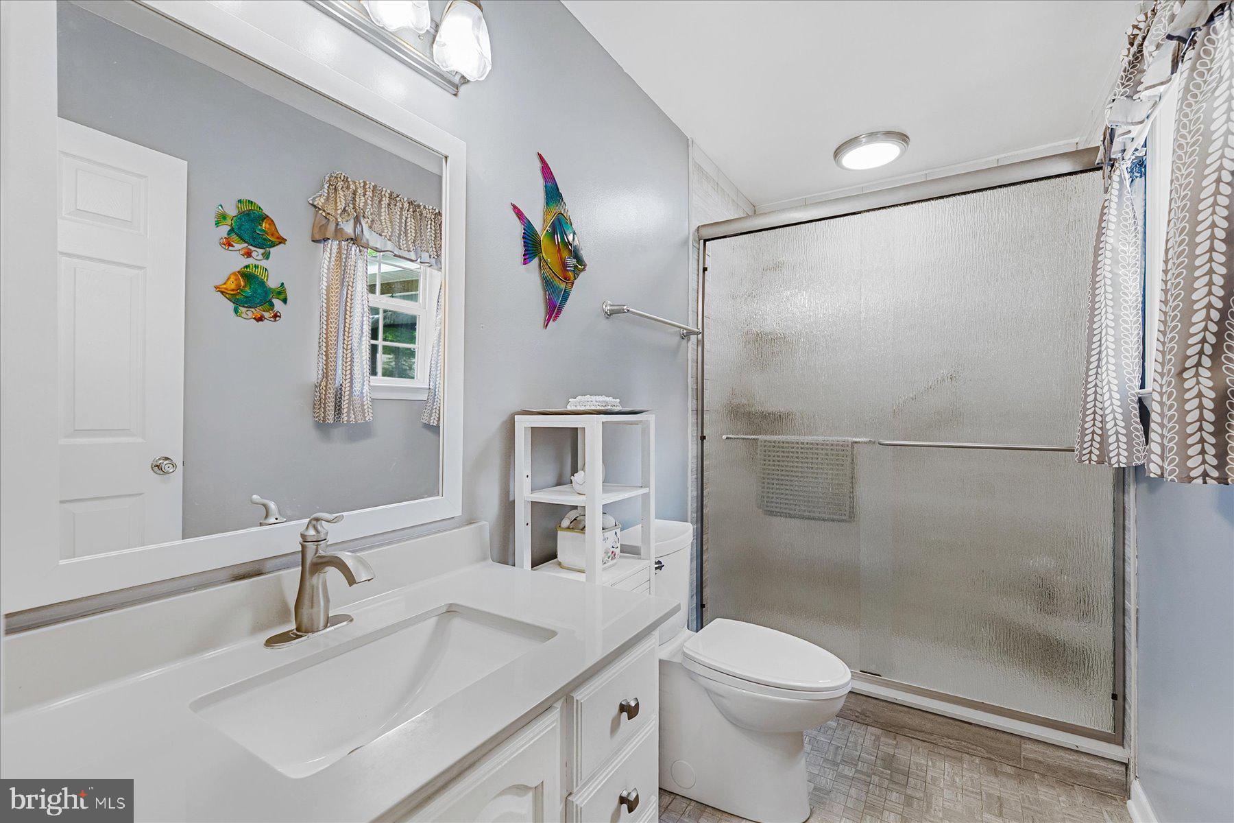120 Pinehurst Road Berlin, MD 21811 - Photo 21 of 37 a bathroom with a sink toilet and shower