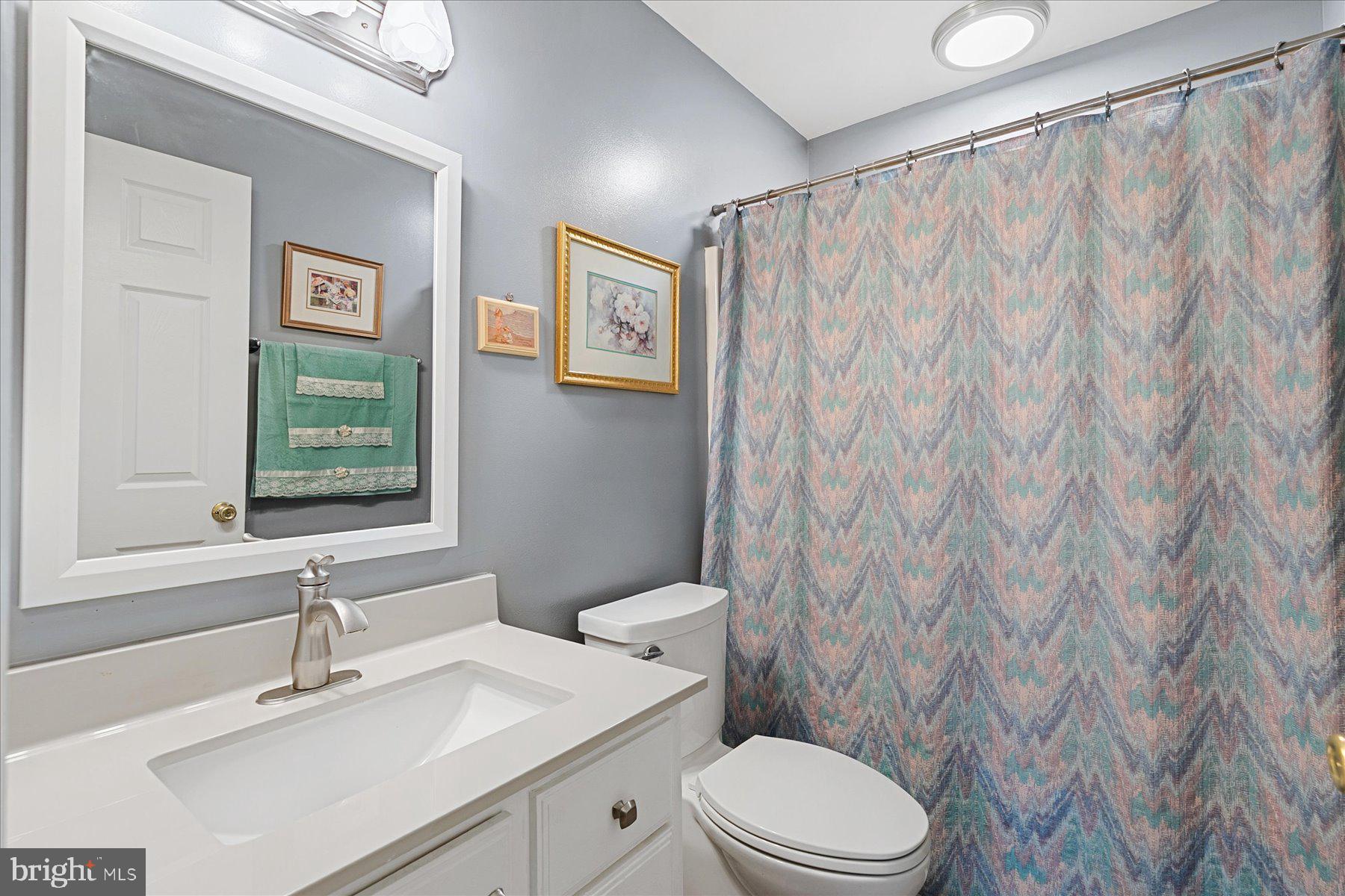 120 Pinehurst Road Berlin, MD 21811 - Photo 22 of 37 a bathroom with a sink a toilet and a mirror