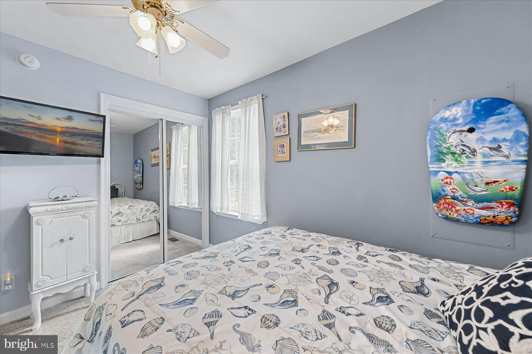 120 Pinehurst Road Berlin, MD 21811 - Photo 25 of 37 a bedroom with a bed and a chandelier