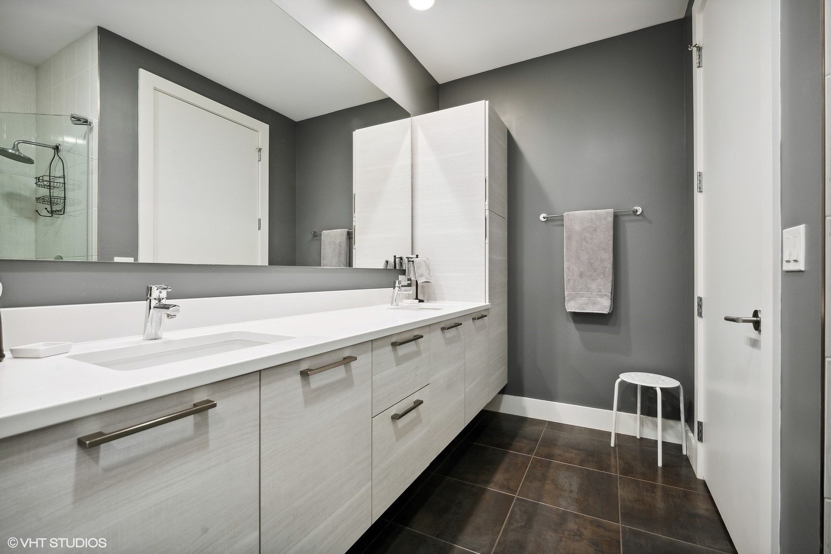 1120 West Adams Street, Unit 3E Chicago, IL 60607 - Photo 15 of 21 a spacious bathroom with a double vanity sink and mirror
