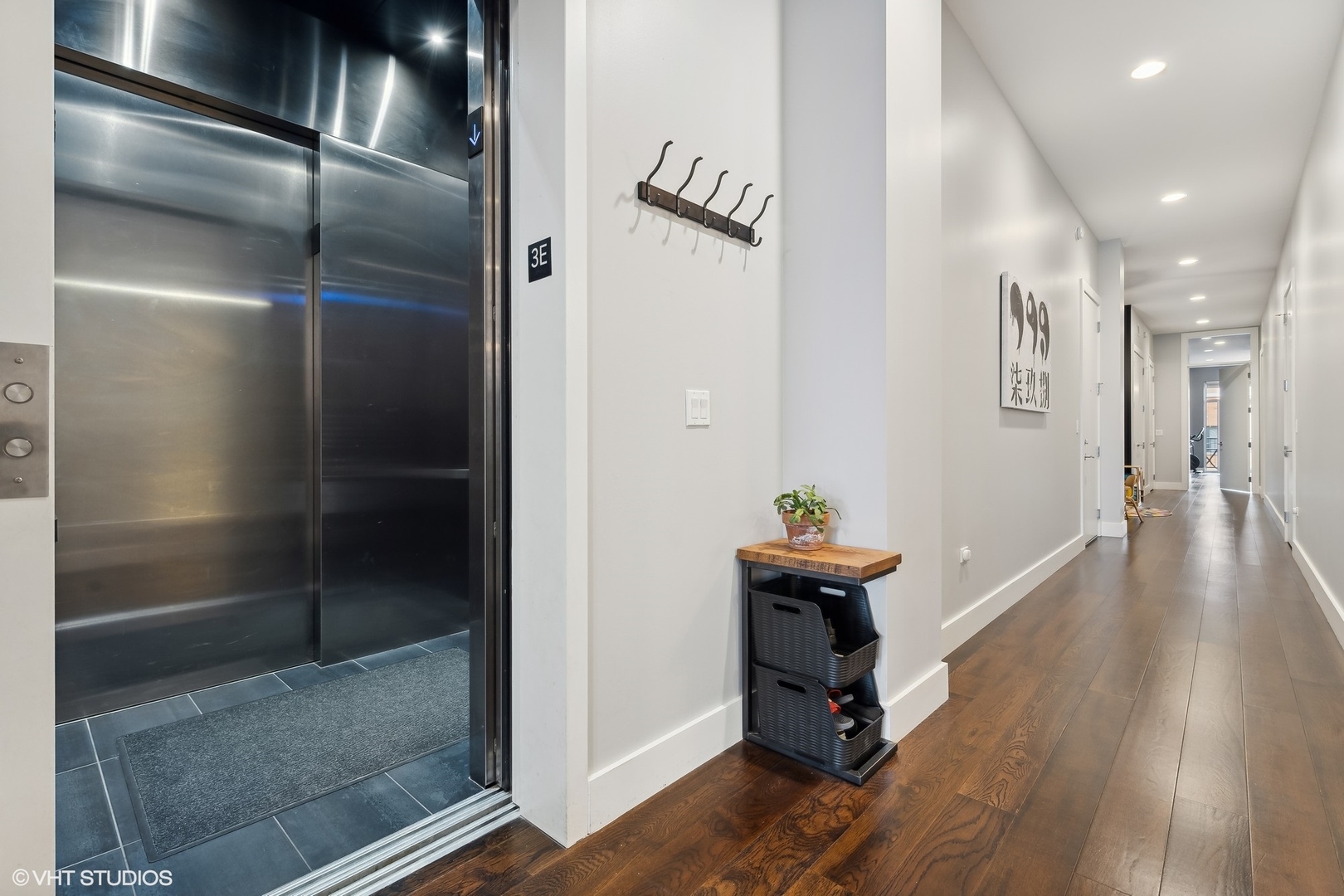 1120 West Adams Street, Unit 3E Chicago, IL 60607 - Photo 18 of 21 a room with wooden floor and gym equipment