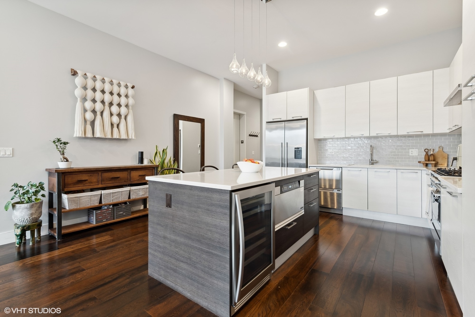 1120 West Adams Street, Unit 3E Chicago, IL 60607 - Photo 6 of 21 a kitchen with stainless steel appliances white cabinets and wooden floor