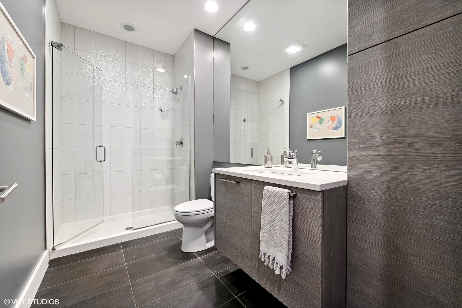 1120 West Adams Street, Unit 3E Chicago, IL 60607 - Photo 8 of 21 a bathroom with a sink toilet and shower
