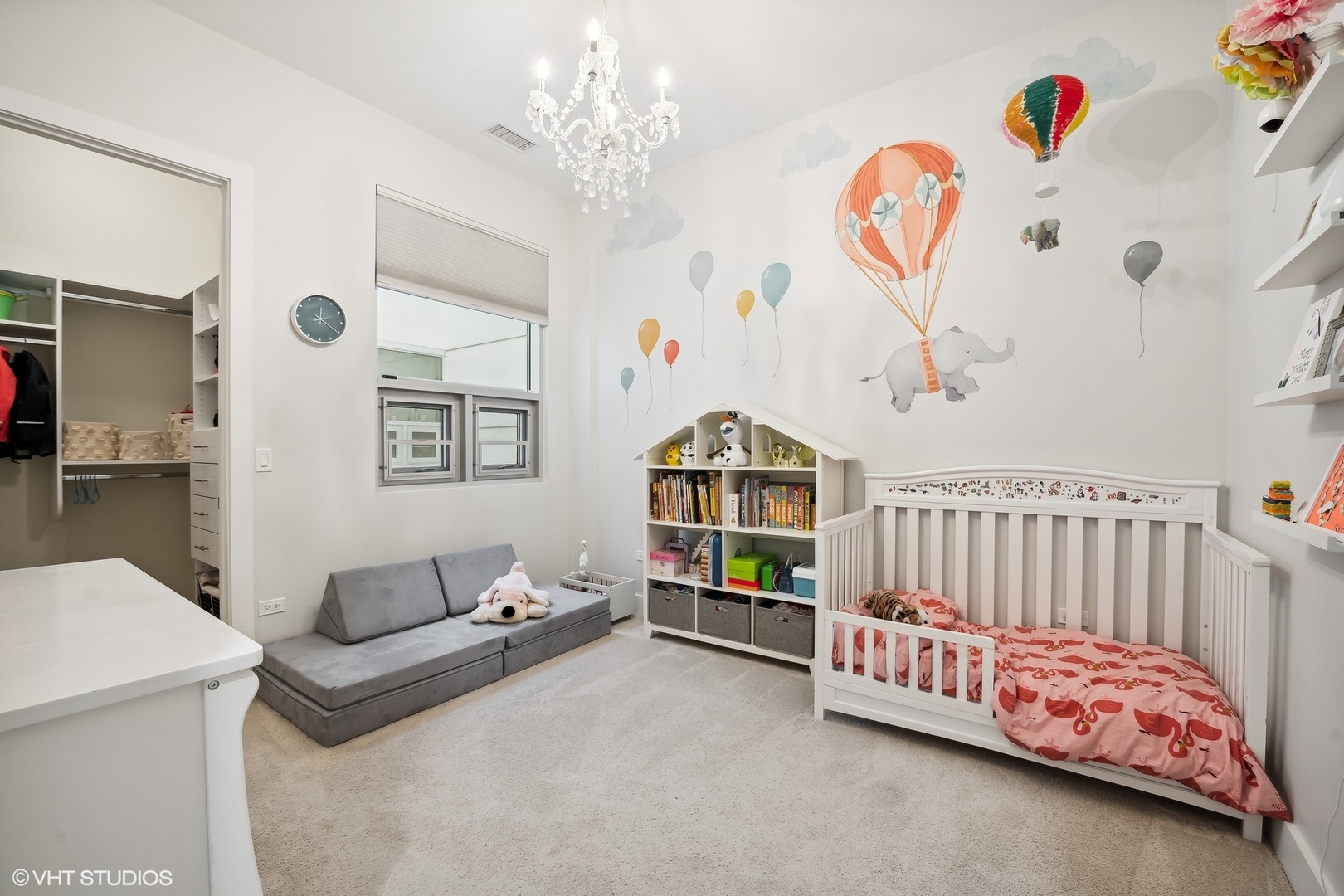 1120 West Adams Street, Unit 3E Chicago, IL 60607 - Photo 9 of 21 a bedroom with furniture and a chandelier
