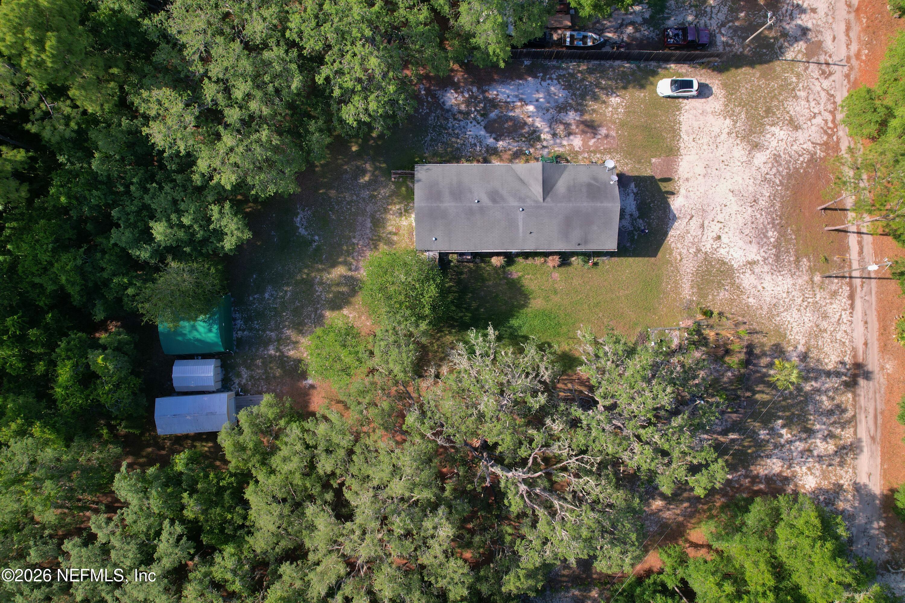 136 Short Pine Road Hawthorne, FL 32640 - Photo 26 of 39 an aerial view of a house with a yard