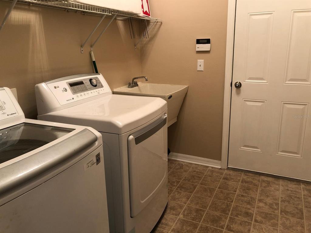 9964 Northwest 22nd Road Gainesville, FL 32606 - Photo 7 of 20 a utility room with dryer and washer