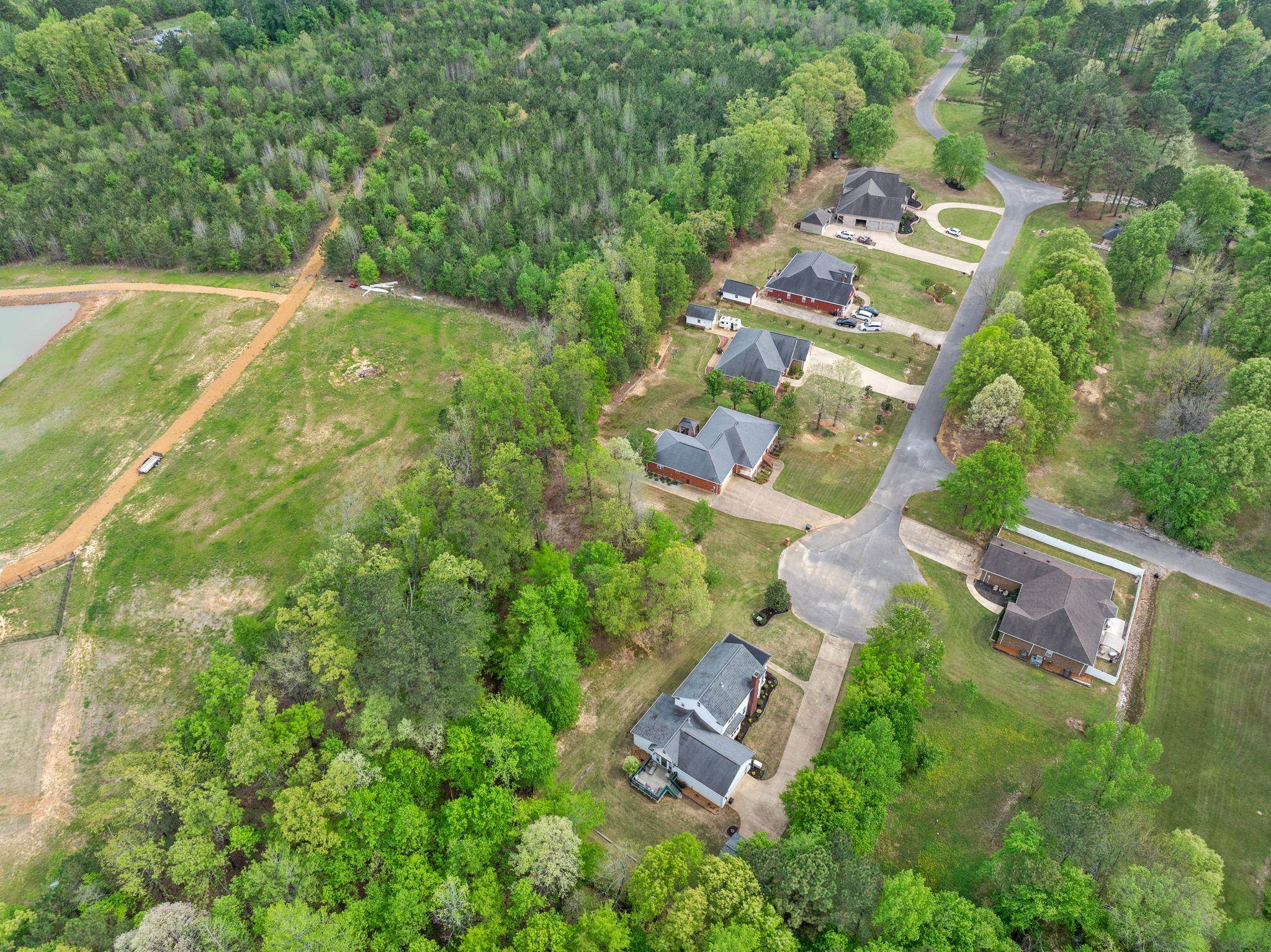 Tbd Lot 37 Tbd Lane Corinth, MS 38834 - Photo 8 of 13 an aerial view of residential house with outdoor space and trees all around