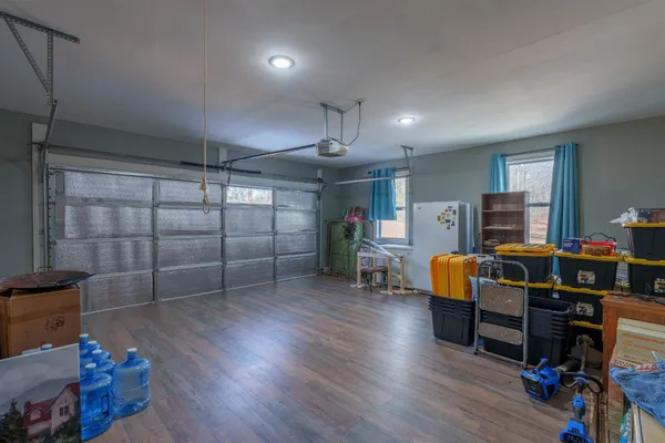 a view of a livingroom with furniture and wooden floor