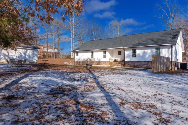 a view of a backyard of the house