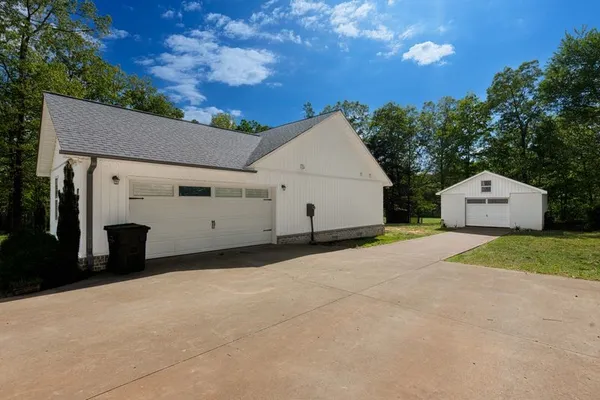 a house view with a garden space