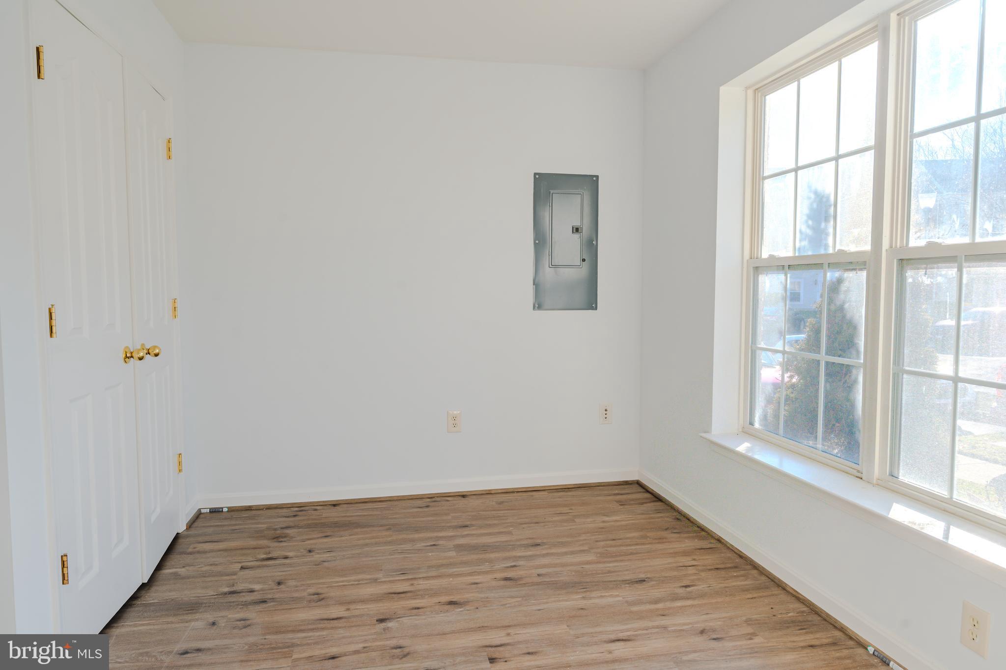 2011 Weitzel Court Frederick, MD 21702 - Photo 16 of 49 wooden floor in an empty room with a window