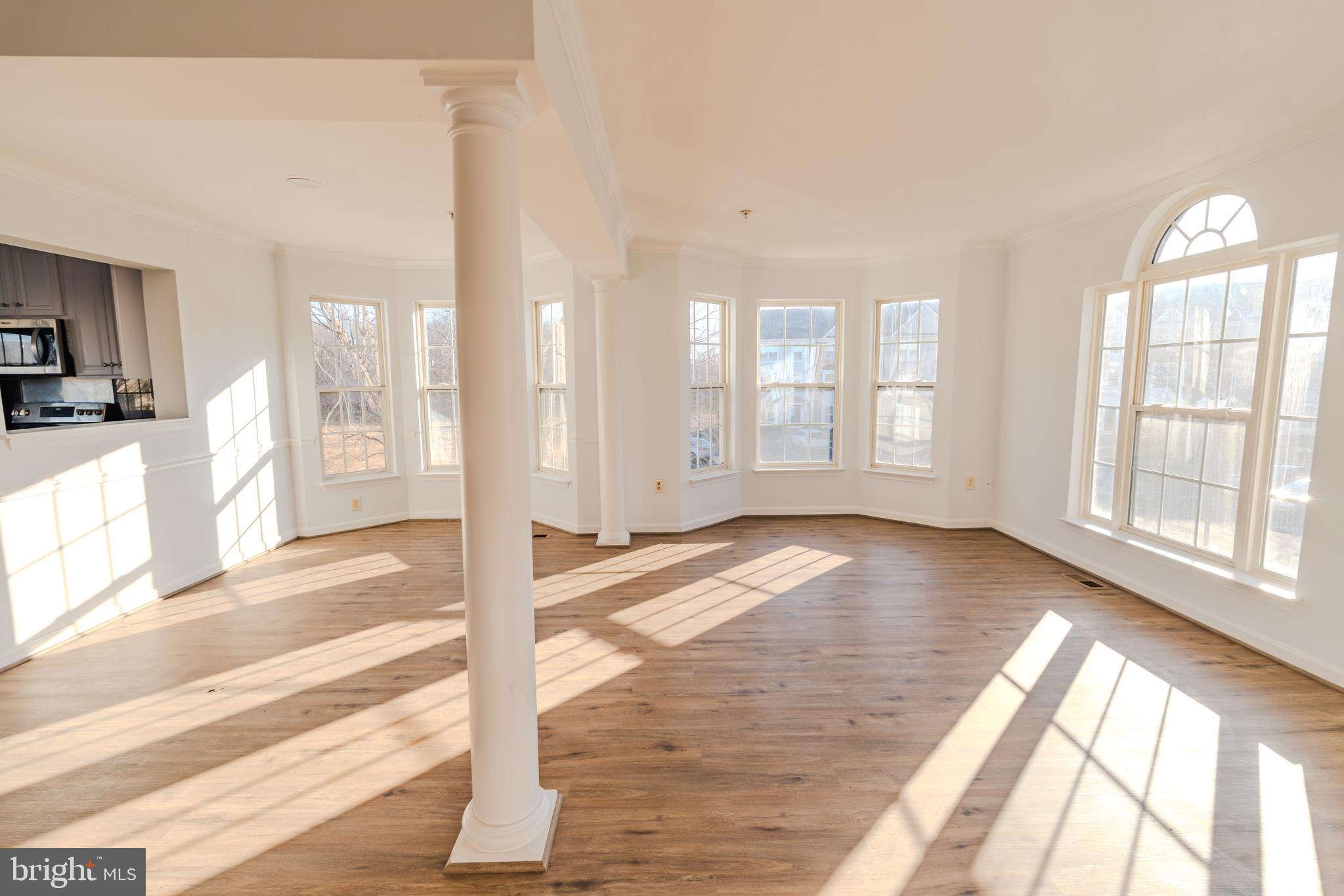 2011 Weitzel Court Frederick, MD 21702 - Photo 2 of 49 a view of a livingroom with wooden floor and large windows