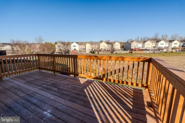 a view of a balcony with wooden floor