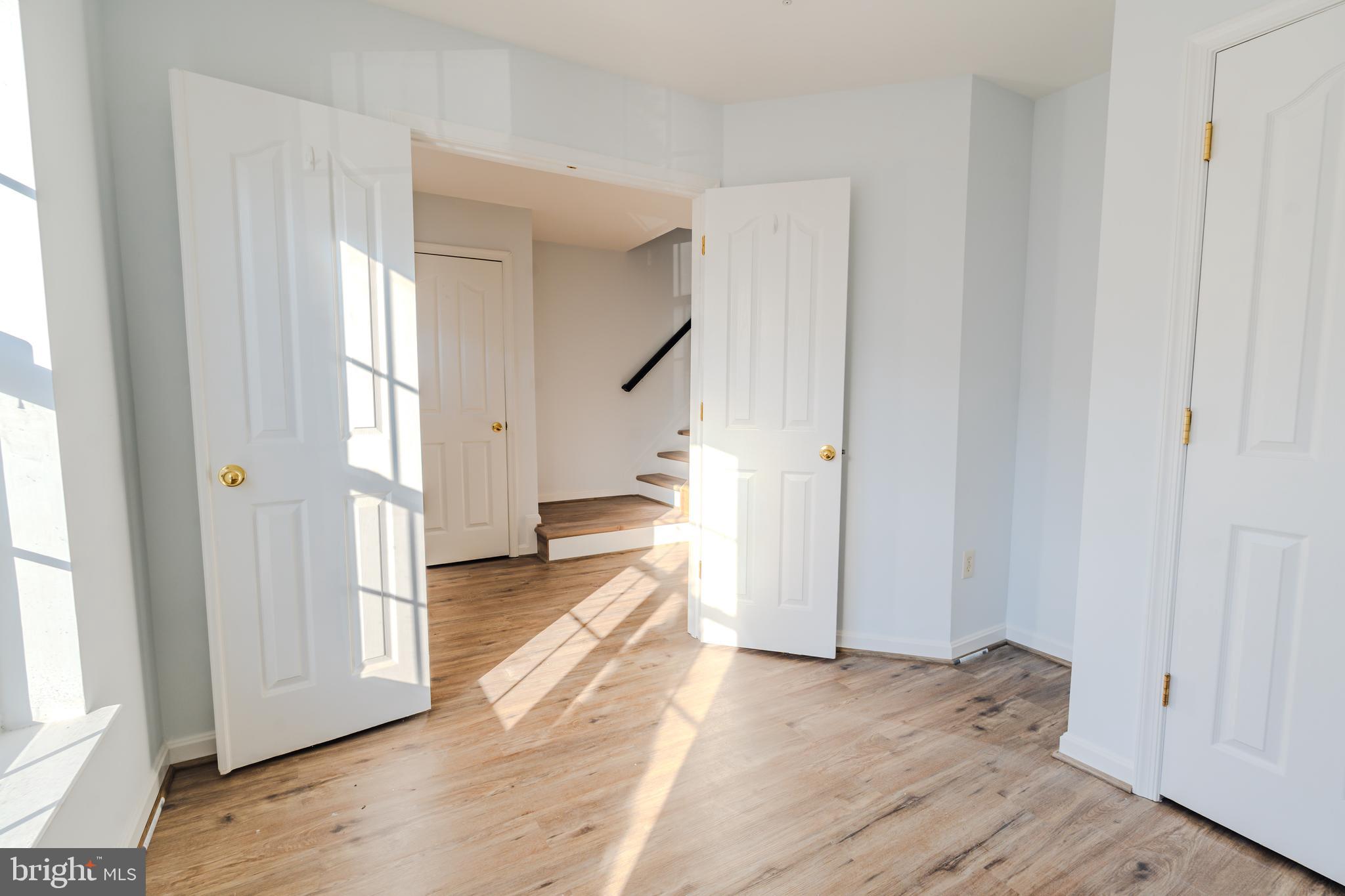 2011 Weitzel Court Frederick, MD 21702 - Photo 43 of 49 a view of a livingroom with wooden floor and stairs