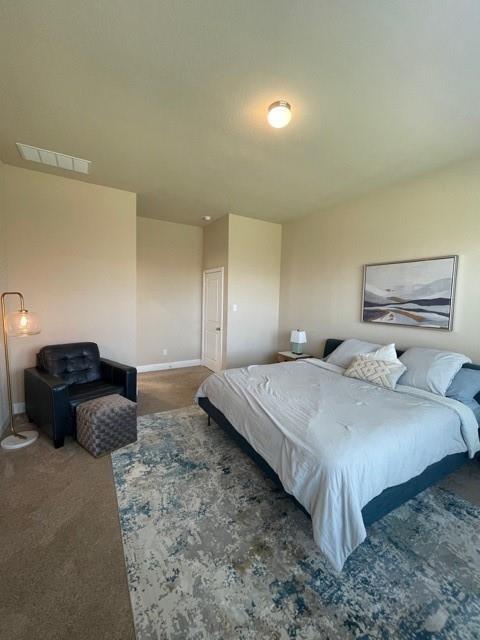 569 Spruce Trail Forney, TX 75126 - Photo 11 of 22 Carpeted bedroom with baseboards