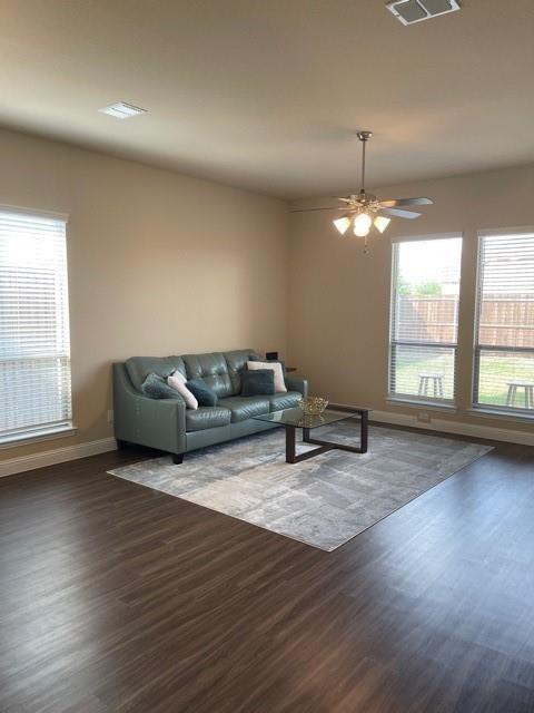569 Spruce Trail Forney, TX 75126 - Photo 13 of 22 Living area featuring dark wood-style floors and ceiling fan