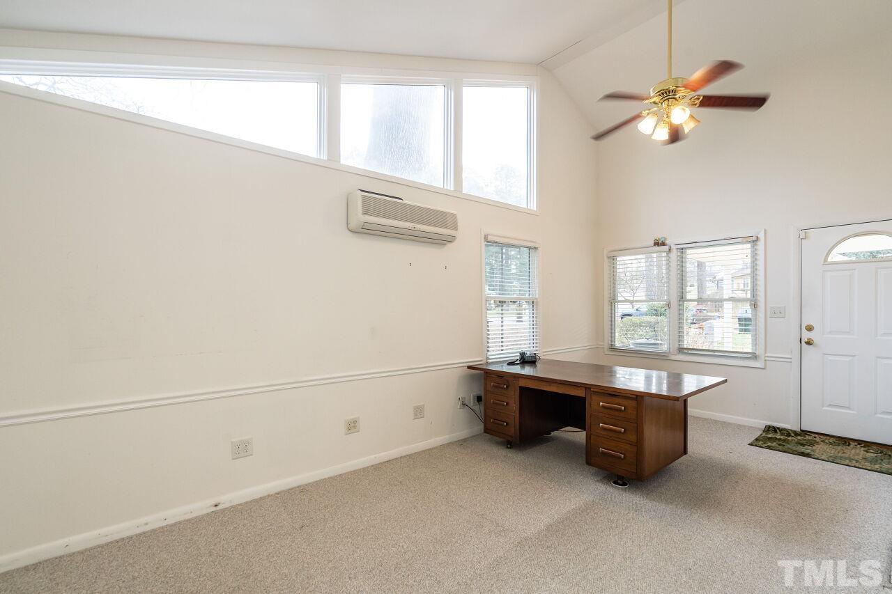 211 Quail Drive Raleigh, NC 27604 - Photo 13 of 28 a room with windows and ceiling fan