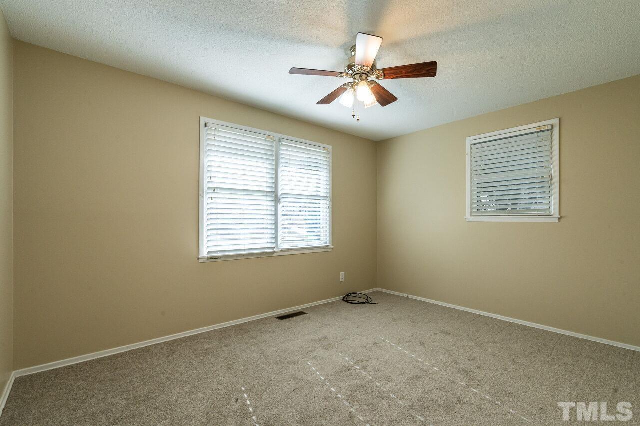 211 Quail Drive Raleigh, NC 27604 - Photo 16 of 28 a view of an empty room with a window