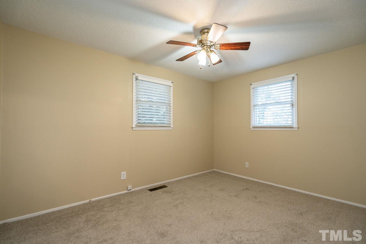 211 Quail Drive Raleigh, NC 27604 - Photo 17 of 28 an empty room with a window